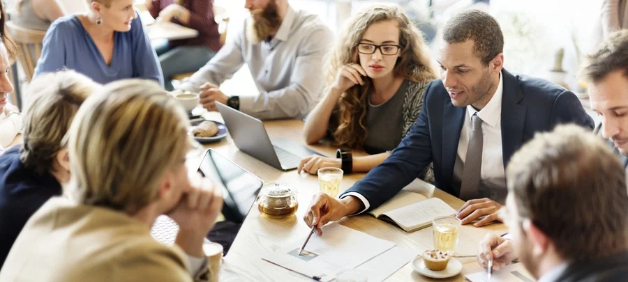 Woman looking excluded in meeting